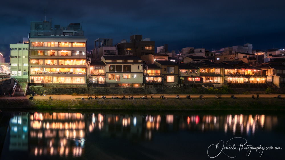 Japan -Kyoto Promenade at night along Kamo River next to Shijoo Bridge